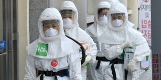 Nurses in protective gear arrive to care for patients infected with the coronavirus at Keimyung University Daegu Dongsan Hospital in Daegu, South Korea, on April 29